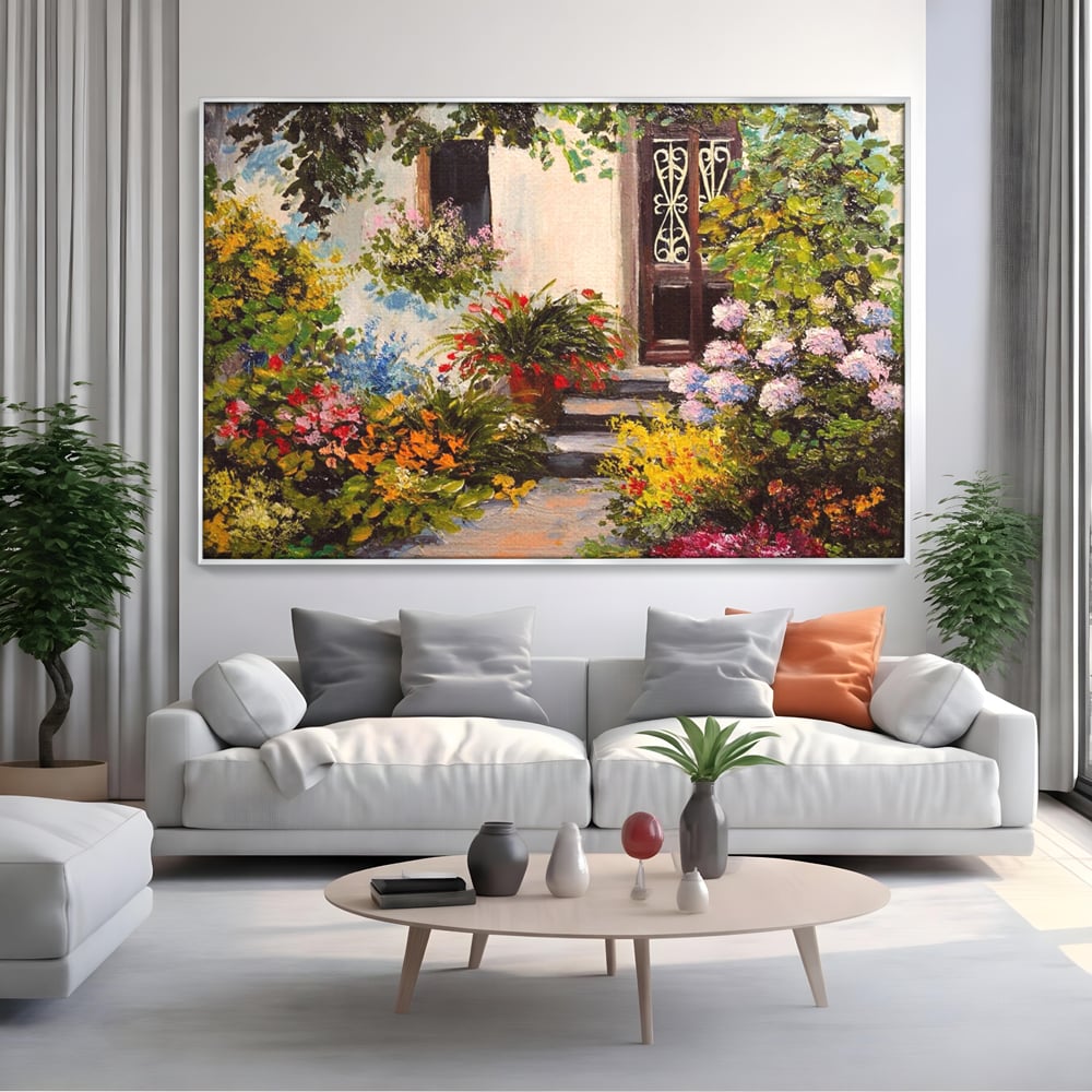 Tablou canvas cu tablou canvas cu alee florala si casa, in rama de aluminiu argintiu, pe perete intr-un living